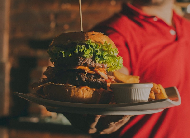 Man Holding Burger